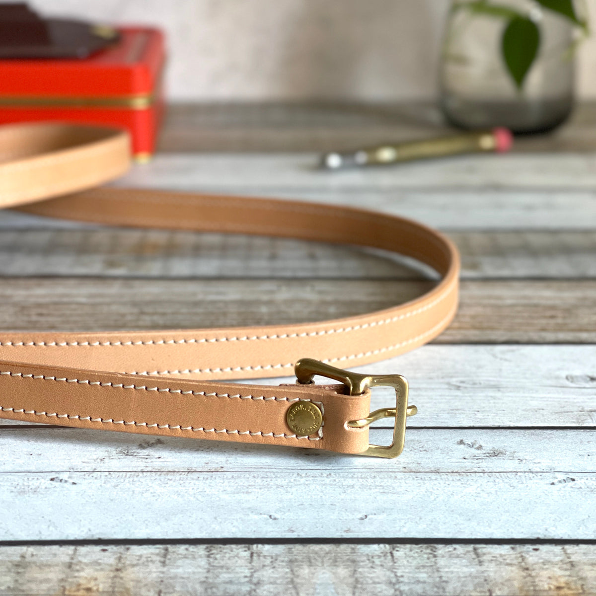 A Louis Vuitton strap replacement Made from vachetta leather then colo